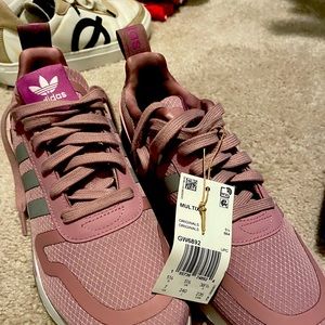 Brand new Adidas sneakers with tags and box.